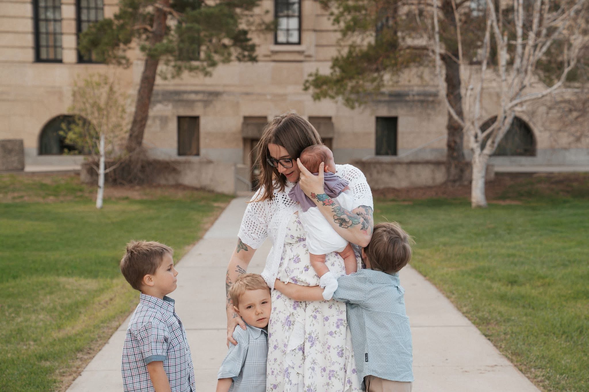 Kennedy surrounded by her children, holding her newborn baby