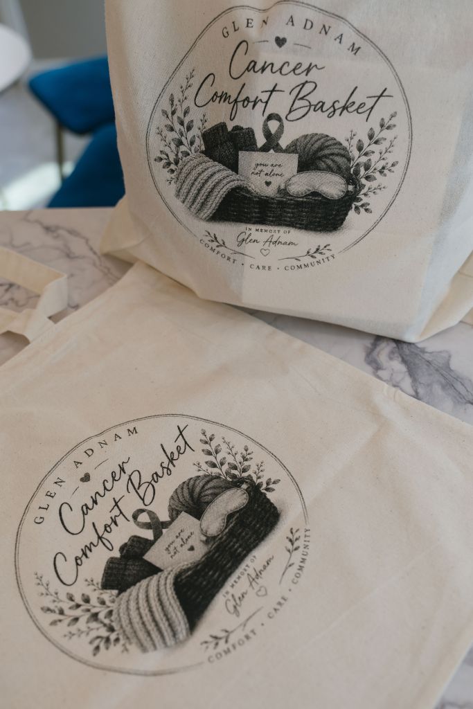 Reusable tote, blanket, and comfort items displayed together