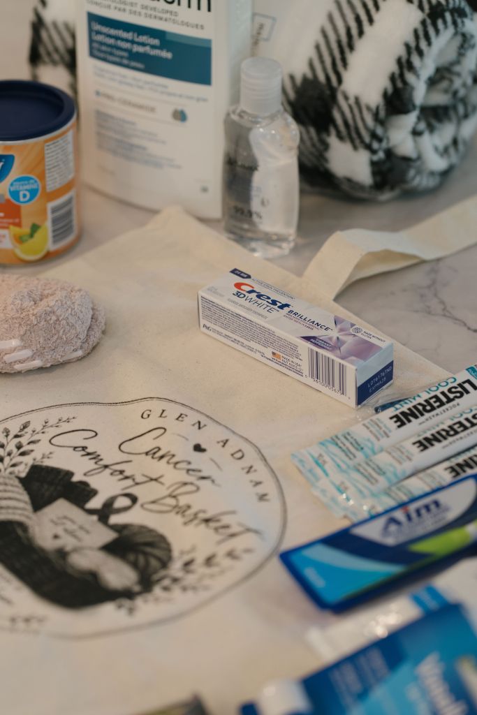 Comfort basket items including blanket, socks, and personal care supplies