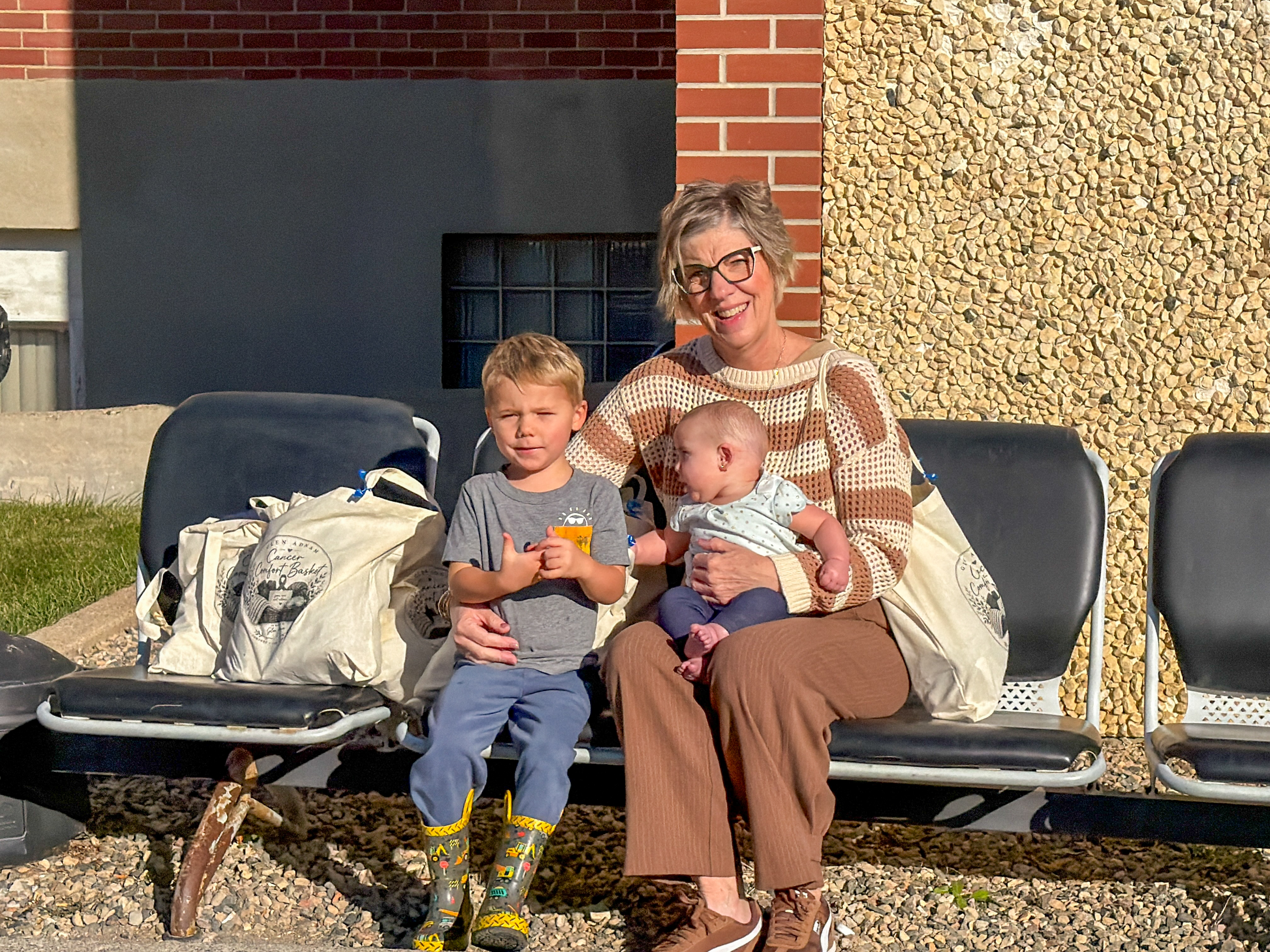 Family sharing a moment beside the comfort bags